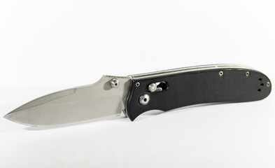 Open folding knife on a white background