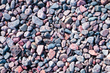 Background, texture of pebbles on the sea coast.