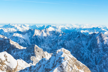 Fototapeta na wymiar Snow Mountain Range Landscape with Blue Sky from Zugspitze Mountain in Germany