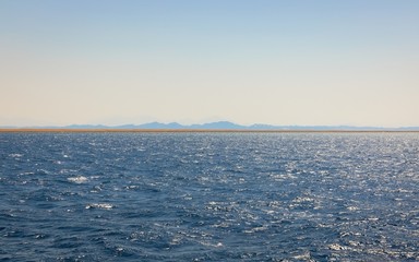 Land over the horizon with mountains