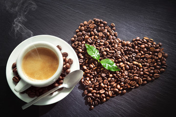 Cup of espresso with coffee beans