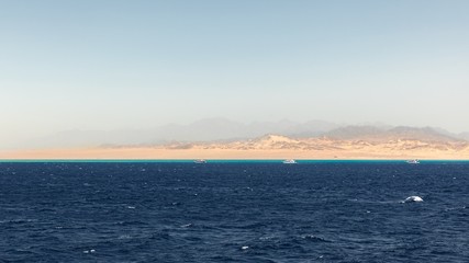 Land over the horizon with mountains