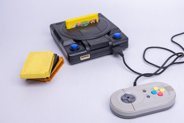 Old game console on a white background. Place for text