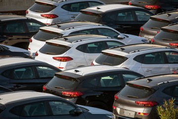 Lot of cars being transported to trade location