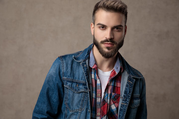 casual young fashion model wearing blue denim jacket