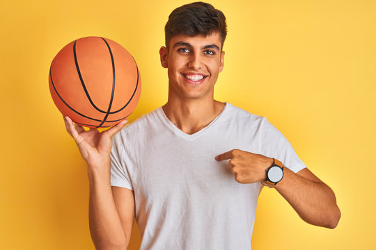 Young Indian Sportsman Holding Basketball Ball Standing Isolated Yellow  Background Happy Face Standing Smiling Confident Smile Showing Teeth Images  – Browse 7 Stock Photos, Vectors, and Video