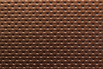 surface of brown sofa leatherette upholstery. Pattern, texture background