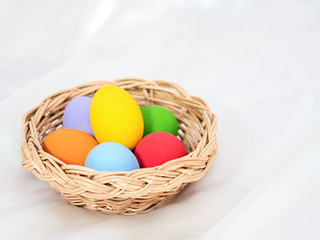 fresh eggs on wooden box with colorful painted on outer surface