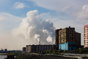 The smoke of the Norilsk combine. The sky in the smoke from the chimneys of Norilsk Nickel plant.