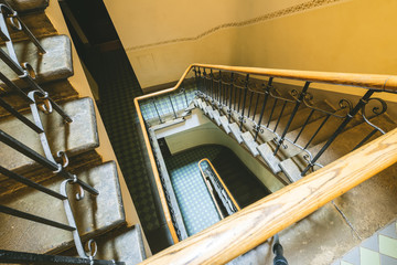 Obraz premium Staircase in the modern light entrance. Wooden railing. Filtered.