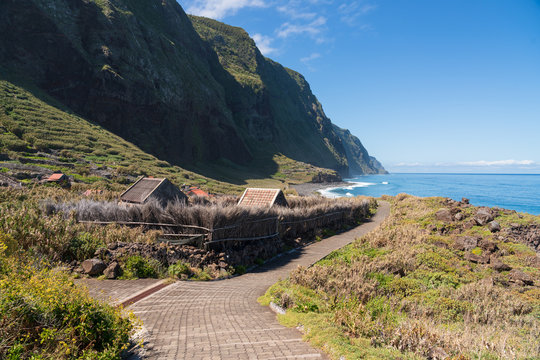 Cultivated gardens at the foot of the cliff coast at Achadas da Cruz