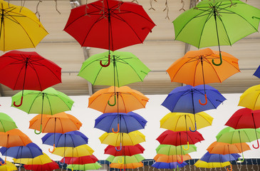 Fototapeta na wymiar seamless pattern with umbrellas. Abstract background with red, yellow, green, blue, orange umbrellas..