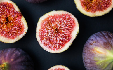 Fresh ripe figs on a dark table. Healthy Mediterranean figs, beautiful blue purple Fig, selective focus