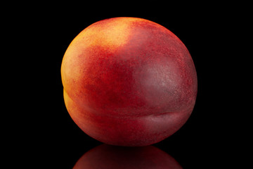 Ripe nectarine fruit on black