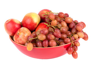 mixed set of fresh raw ripe fruits apple and grape on wooden plate isolated on the white background