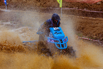 Mud splatter around an ATV in a swamp