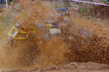 Mud splatter around an ATV in a swamp