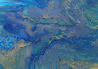 art photography of abstract marbleized effect background. blue and gold creative colors. Beautiful paint.