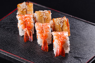 Japanese food, tasty of meal for lunch. Seafood. Sushi with Shrimp and eel black background.