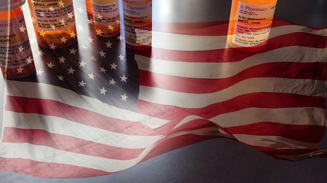4k Slow Motion Medicine Bottles and Pill Falling With Ghosted American Flag Waving