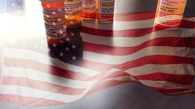 4k Slow Motion Medicine Bottles and Pill Falling With Ghosted American Flag Waving