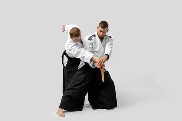 Two caucasian men are practicing aikido with waakizashi (isolation path included)