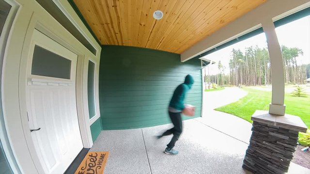 Package thief caught on video doorbell system stealing a box delivery