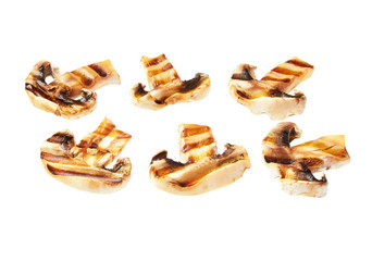Grilled sliced champignons isolated on white background