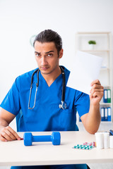 Young male doctor in sport and dieting concept