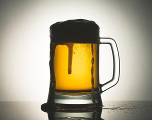 Glass of beer with foam