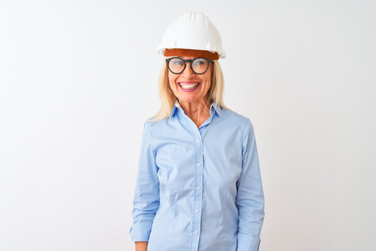 Middle age architect woman wearing glasses and helmet over isolated white background with a happy and cool smile on face. Lucky person.