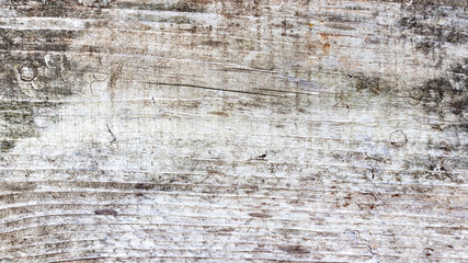 Brown grey scratched wooden cutting board. Old natural wooden shabby background close up. Wood texture.