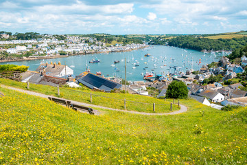 Beautiful Cornish harbour towns of Fowey and Polruan, with boats moored in Fowey Estuary, South...