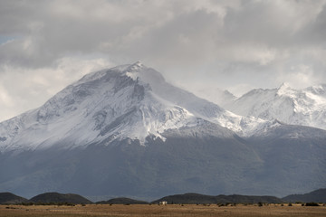 Fototapeta premium Snowy mountain peak in moody weather. Puerto Natales, Provincia de Magallanes, Chile