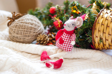 Christmas card with toy mouse in red hat