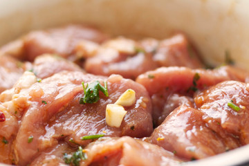 marinated meat pieces with garlic and parsley 