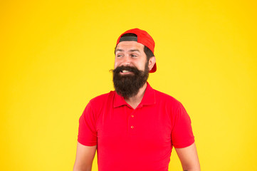 Salesman career. Hiring shop store worker. Hospitality staff. How can I help you. Supermarket staff wanted. Man bearded hipster with mustache wear uniform yellow background. Shop staff concept