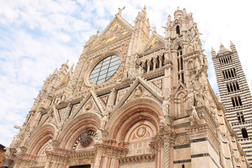 The huge majestic cathedral of Saint Mary of the Assumption on the Duomo Square, a medieval church in Siena, Tuscany, Italy