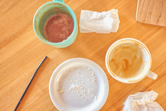 Mess On The Table With Dirty Cups And Plate After Breakfast. View From Above.