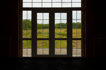 window with a view of the forest