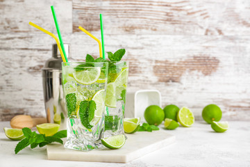Glasses of fresh mojito on table
