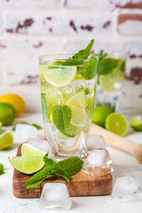 Glass of fresh mojito on table