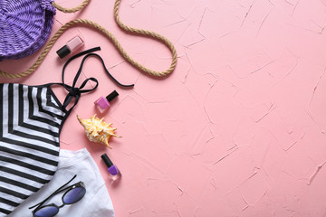 Summer composition with female clothes and accessories on color background