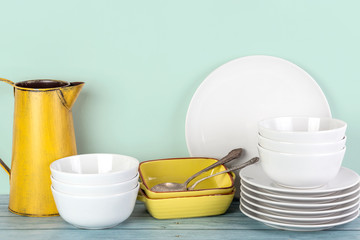 Fototapeta na wymiar Kitchen dishes and utensils on a shelf