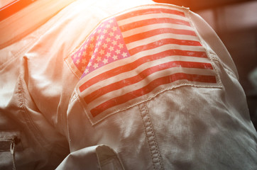 American flag on the shoulder of an astronaut's spacesuit.