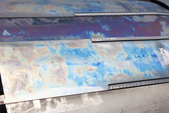 Scratched colored metal texture, neon steeel background
