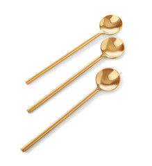 Golden spoons on white background