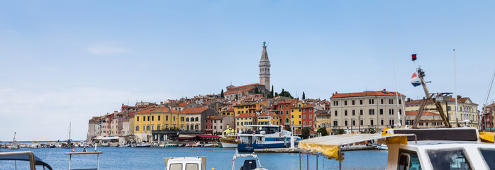 Multiple image panorama of the charming and atmospheric old town of Rovinj perched on a hill above the Adriatic Sea.