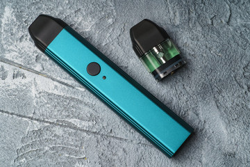 Vape pod system or pod mod with changeable cartridges close up - newest generation of vaping...
