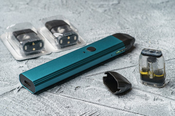 Vape pod system or pod mod with changeable cartridges close up - newest generation of vaping...